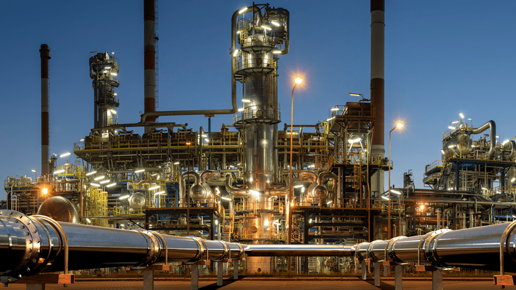 Image of an oil refinery at night.