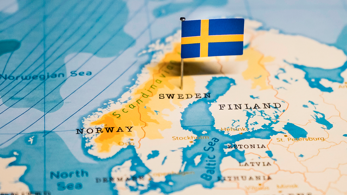 Map of Nordic region with a flag of Sweden pinned to Sweden.