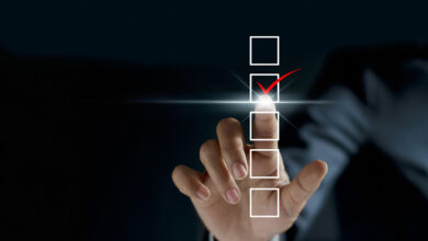 A checklist graphic overlays a photo of a person's hand making a checkmark motion.