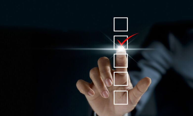A checklist graphic overlays a photo of a person's hand making a checkmark motion.