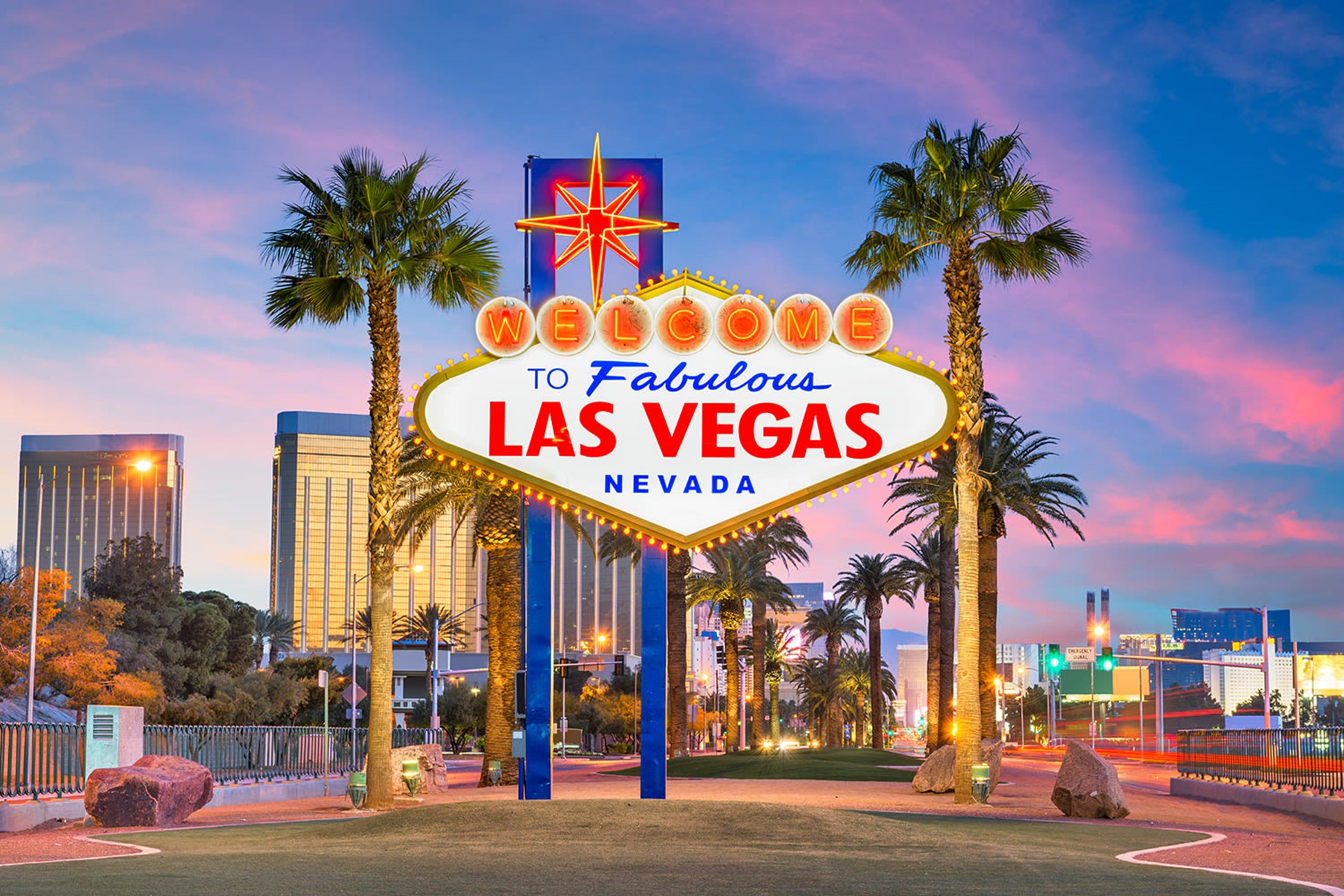 Image of the Fabulous Las Vegas Nevada sign with Las Vegas skyline in the background.