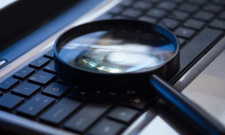 Image of a magnifier placed over a keyboard.