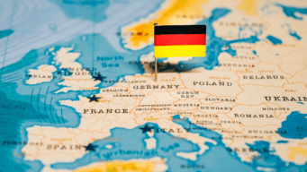 This is an image of a map of Europe with Germany highlighted with a German flag.