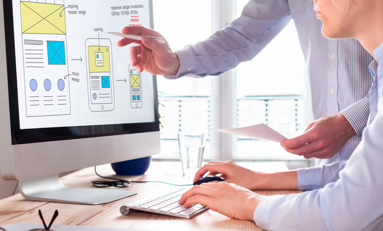 A web development team works on design prototypes.