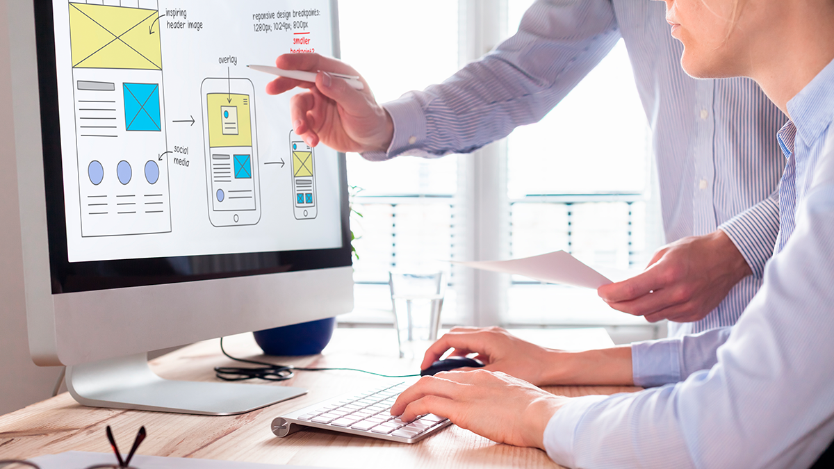 A web development team works on design prototypes.