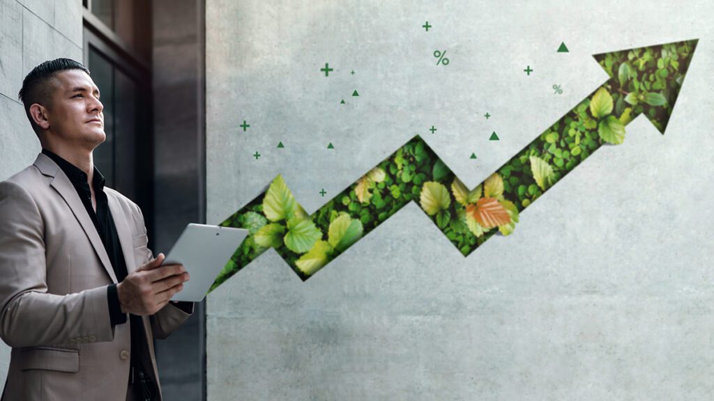 An image of businessman with an upward error indicating positive change in ESG and sustainability goals