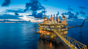 Image of an oil refinery at dusk.