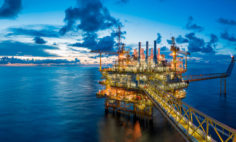 Image of an oil refinery at dusk.