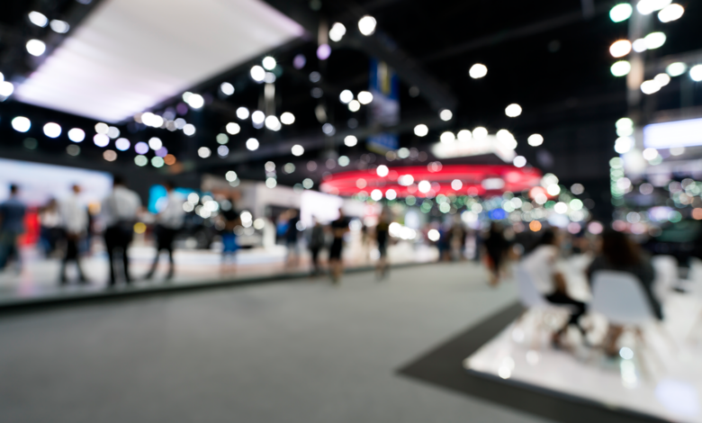 A crowd shot of a busy conference trade show floor.