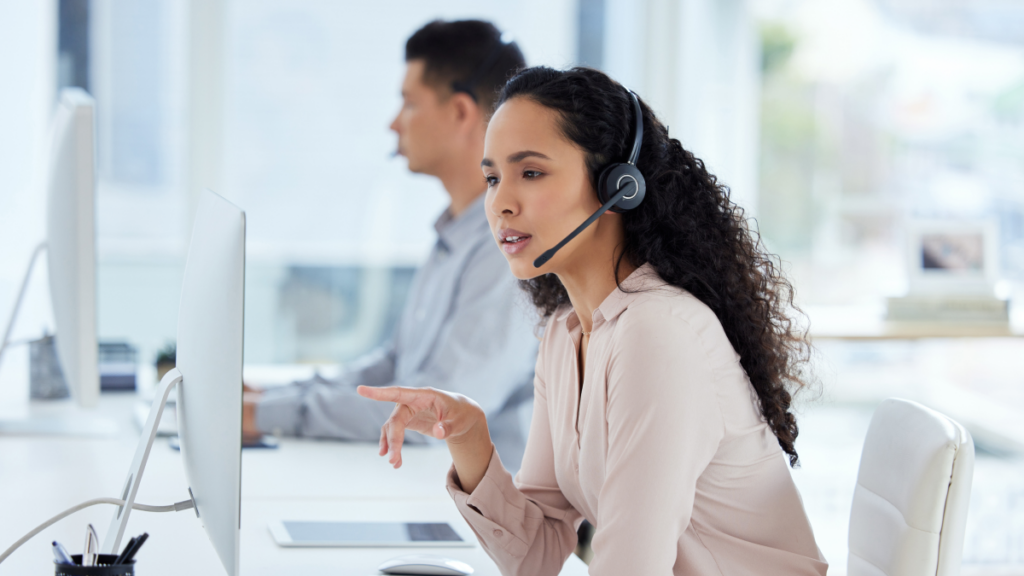 A call center agent works at her computer.