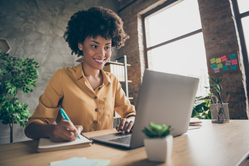 This is an image of a small business woman working on her laptop on MSME day.