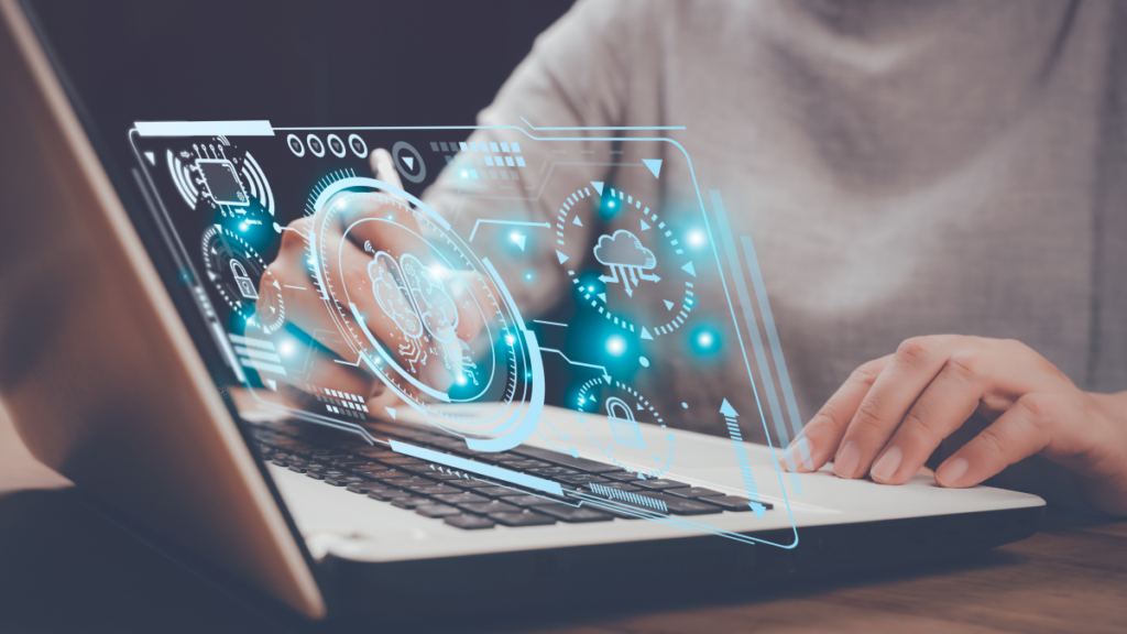 mid-shot of woman at laptop; blue process, security, cloud, and connectivity icons are showing above the keyboard
