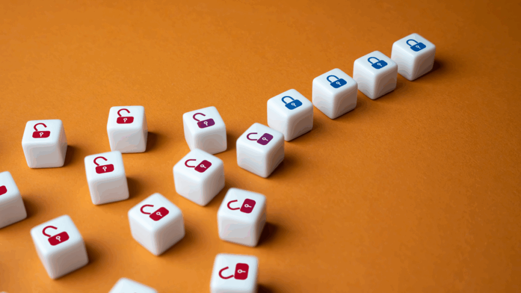 a cluster of dice marked with open red locks lay on a wooden table on the left, but on the right, they are organized in a line and are marked with closed blue locks, showing how robust test management aligns and secures software test management