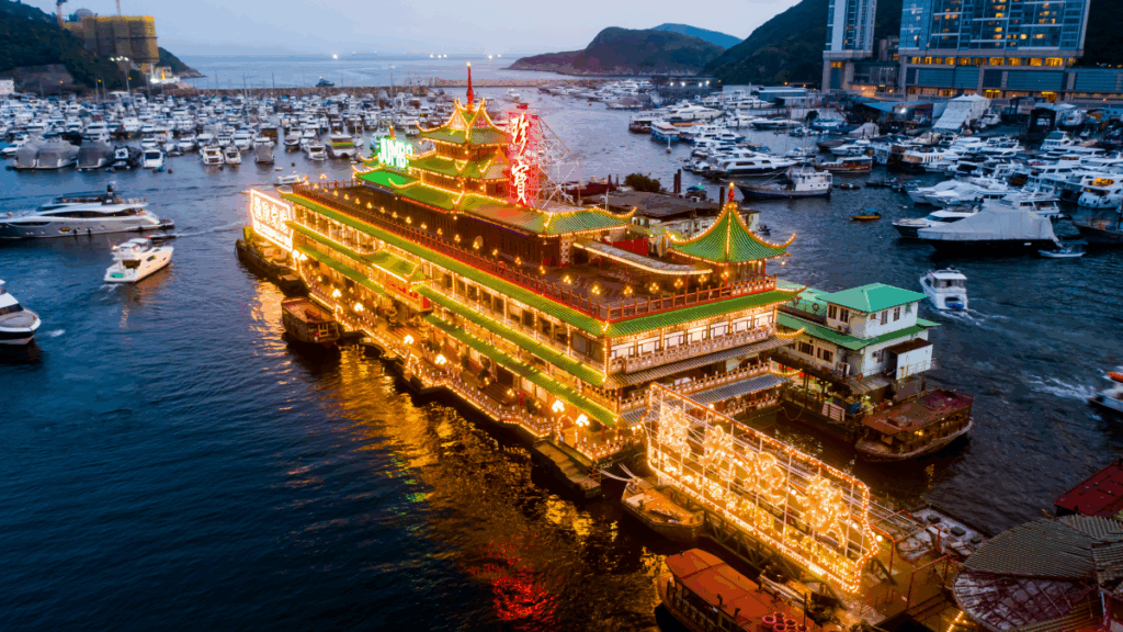image of a ship in hong kong's port at sunset time
