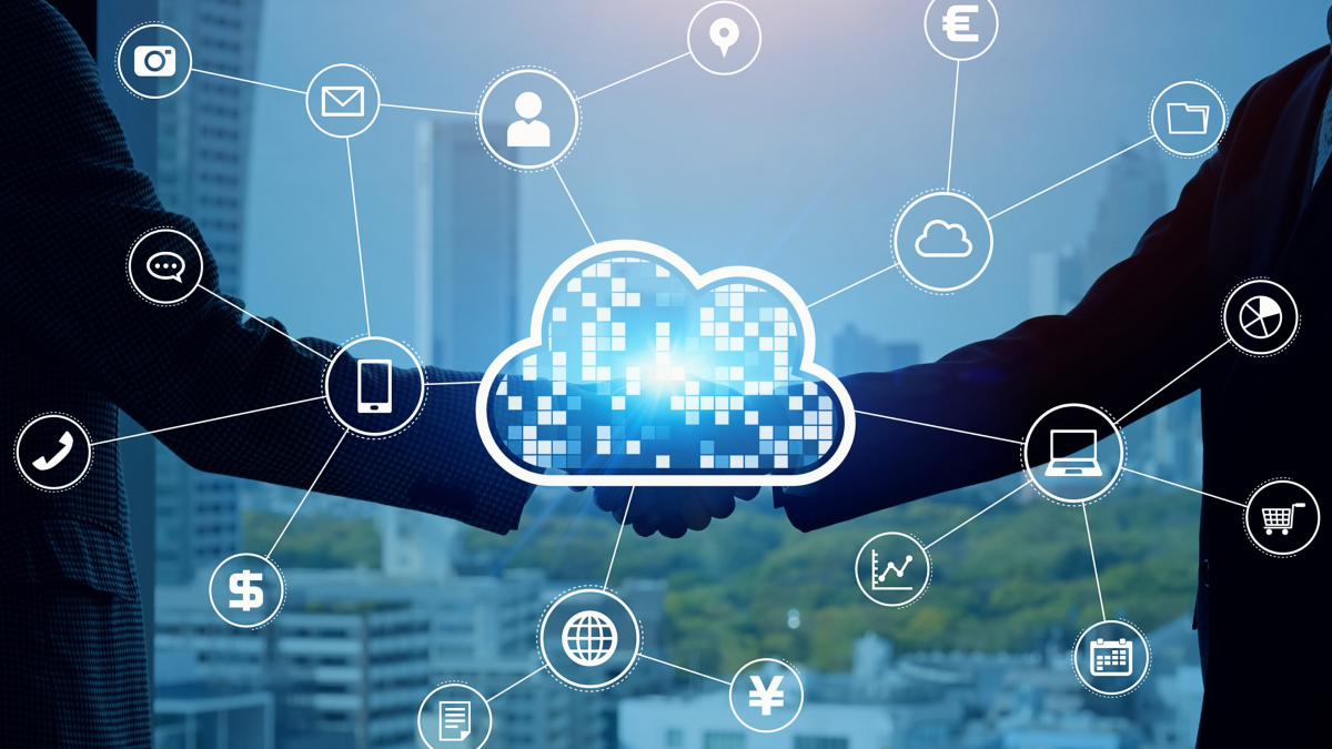 Two businesss people shaking hands with an image of a cloud in the center
