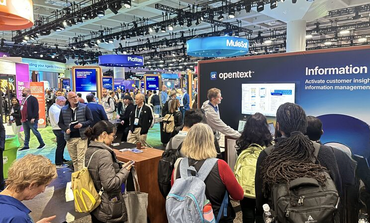 booths at a conference with people browsing the show floor