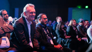 Attendees at OpenText World watching a presenter