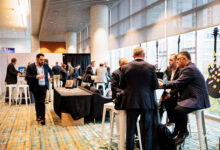 People standing and talking in the lobby at a conference