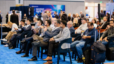 an audience of men and women at OpenText World