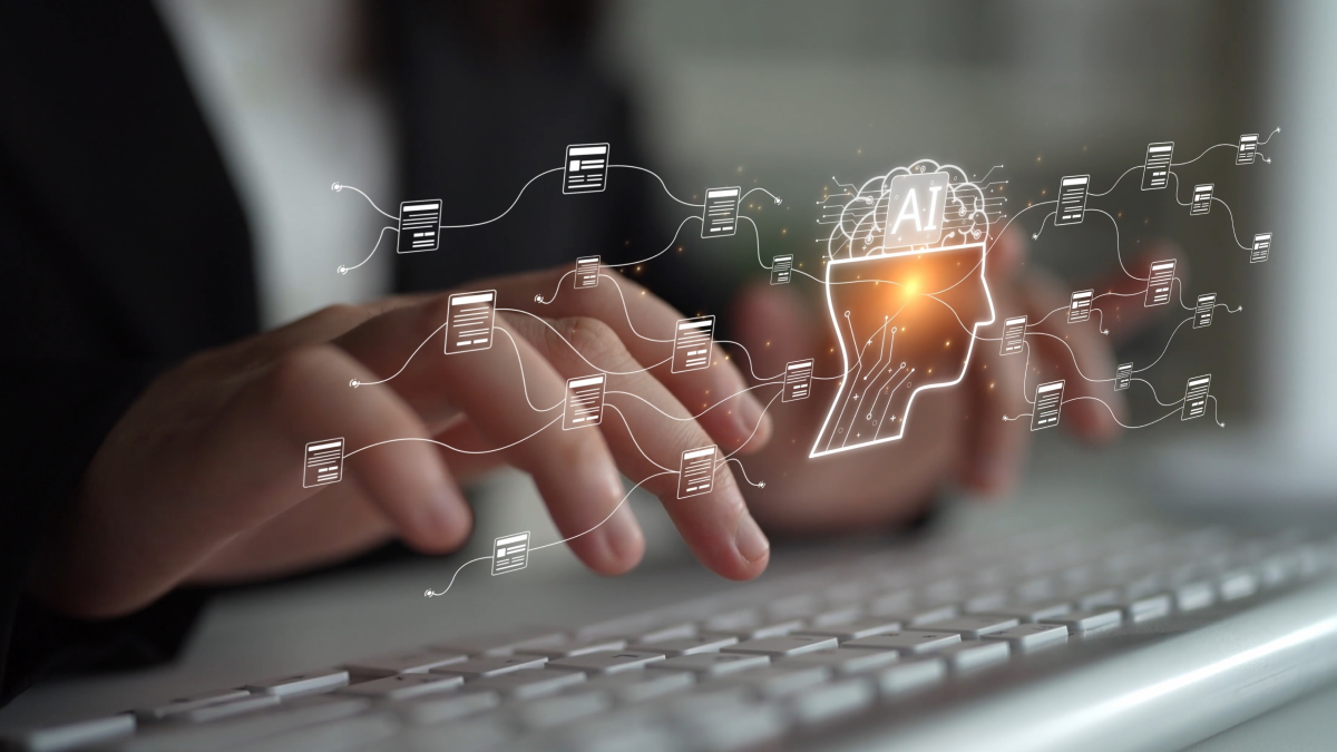 Close-up of hands typing on a keyboard, showing connected business data, automation, and B2B integration.