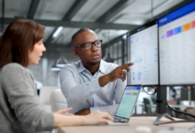 Coworkers collaborating using ERP systems