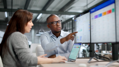 Coworkers collaborating using ERP systems